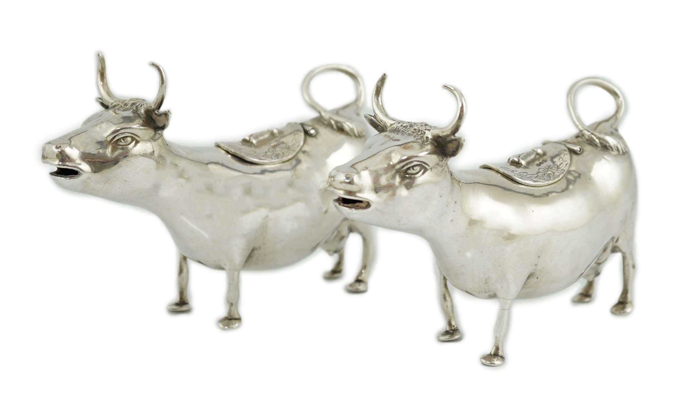 A pair of early 20th century continental silver cow creamers, by Berthold Muller